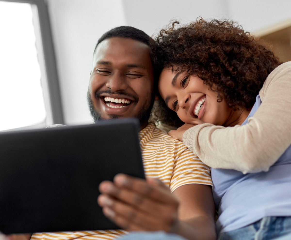 Man looking at credit card and phone