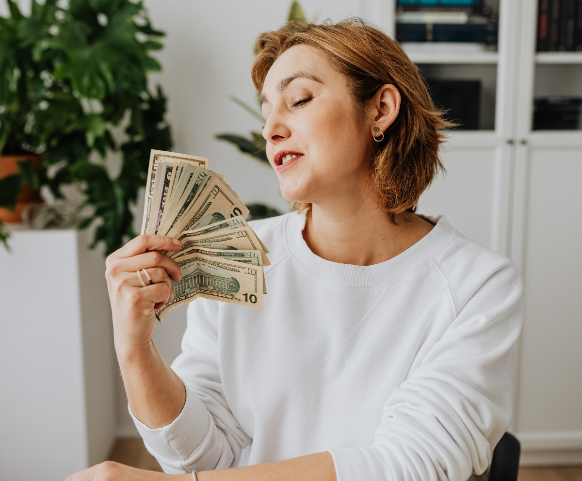 Woman with money from a loan